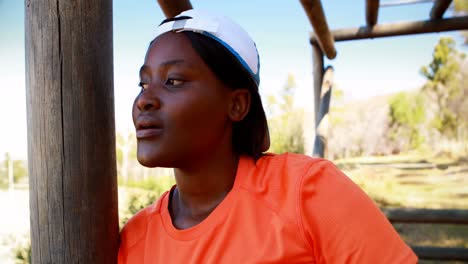 Tired-woman-wiping-her-sweat-during-obstacle-course