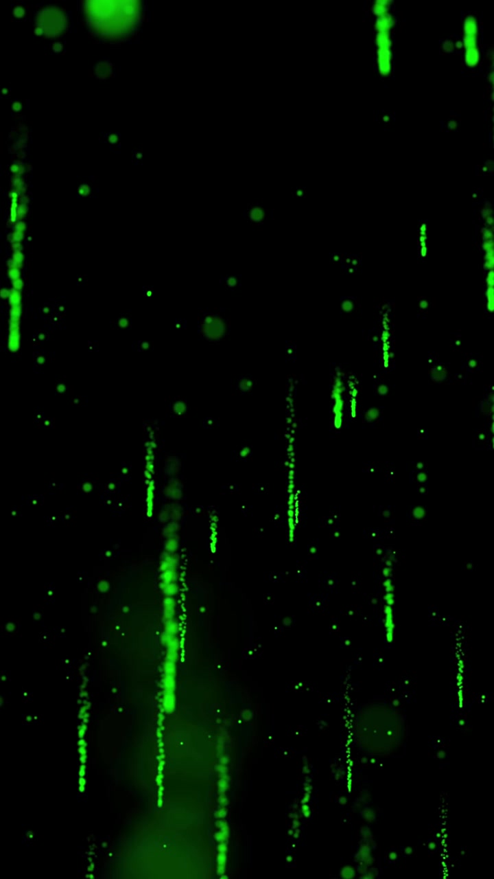 Abstract green particles rain down like digital matrix code or meteor shower on black background. Technology or sci-fi concept, seamless loop, vfx, motion graphic, vertical format