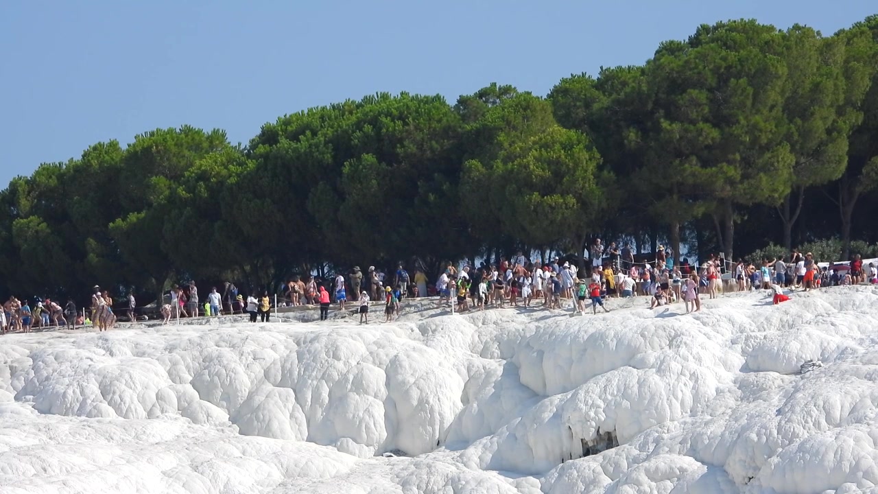 Tourists Walking on White Travertine Terraces in Pamukkale