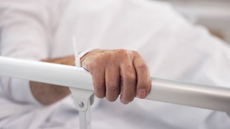 Hand-on-rail,-patient-and-hospital-bed