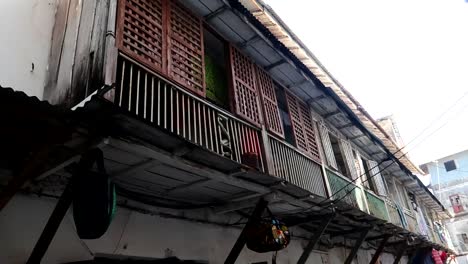 Panning-shot-of-the-houses-above-some-local-stores