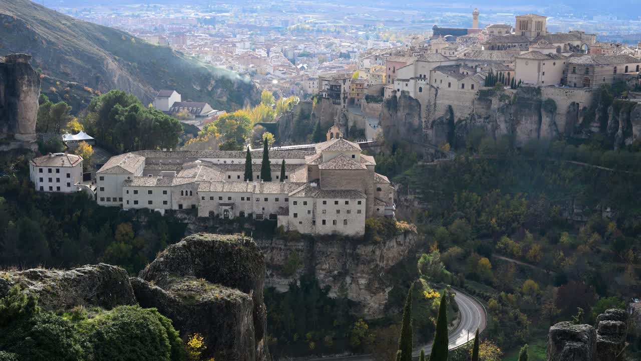 CUENCA, SPAIN - A panoramic view showing the former Convent of San Pablo opposite the famous Hanging Houses, both key landmarks of this historic UNESCO city.