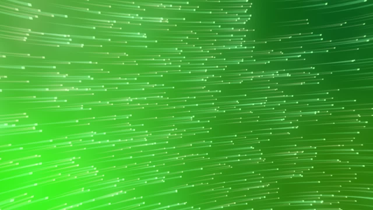 녹색 배경에 대해 원형으로 움직이는 반 ⁇ 이는 빛의 흔적의 디지털 애니메이션