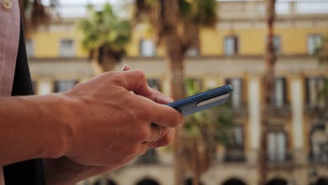 man tourist using smart phone searching location in map application online close up macro. backpacker using gps to find destination on vacation. city or forest hiking, walking in europe