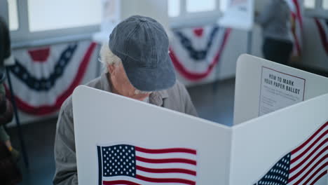 elderly voter casting ballot