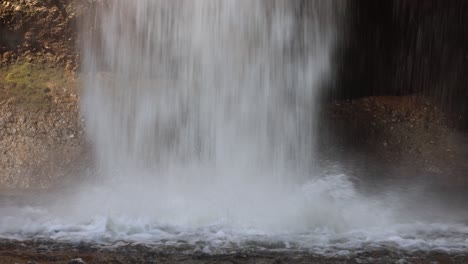 waterfall cascading down into a pool