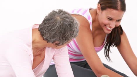 Smiling-fit-women-doing-leg-stretching