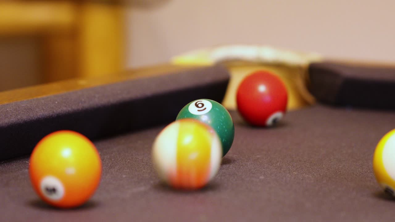 Colorful Billiard Balls Rolling On The Billiard Table