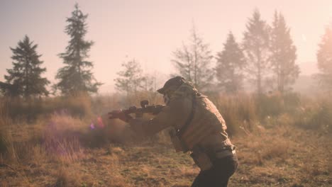 SOLDIER-SHOOTING-AR-TYPE-RIFLE-AND-PISTOL-IN-SLOW-MOTION-IN-THE-FOREST