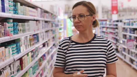 woman shopping for beauty products in a pharmacy