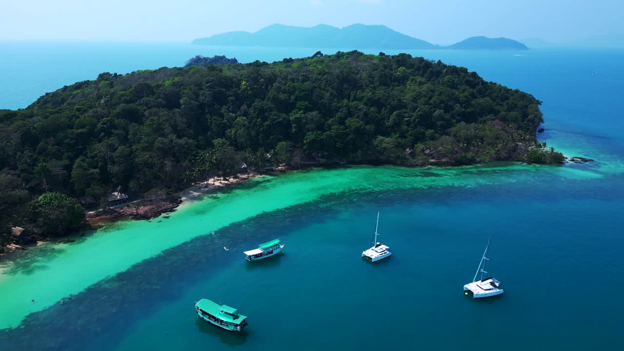 Koh Wai Bay Beach with boats anchored in turquoise waters. Amazing aerial view flight overflight flyover drone