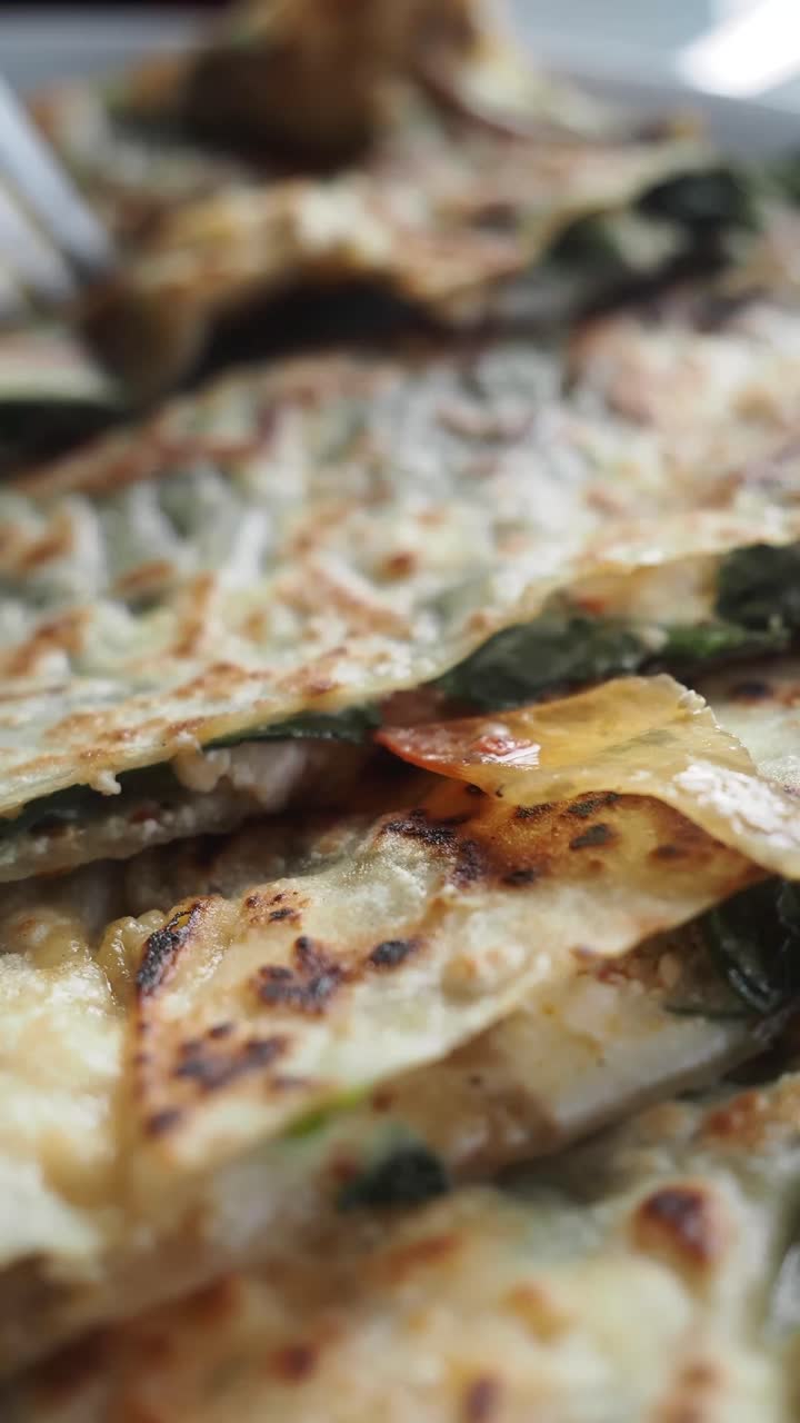 Close-up of Traditional Turkish Gözleme Flatbread with Savory Filling