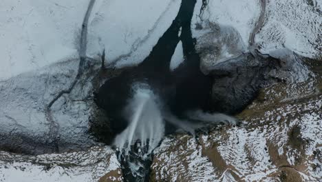 drone footage of waterfall in iceland from above