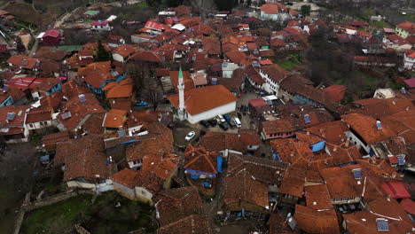 aerial view over rooftops of cumalikizik village in bursa, turkey - drone shot