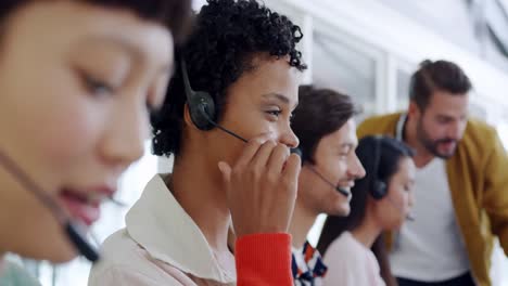 Call-centre-staff-working-in-a-modern-office