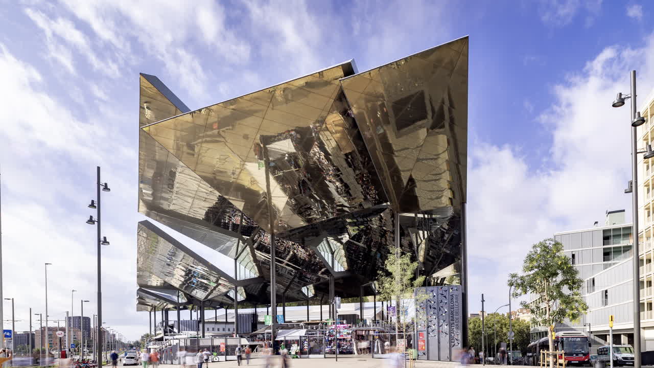 Timelapse of the encants second hand market with gloden reflecting roof in barcelona