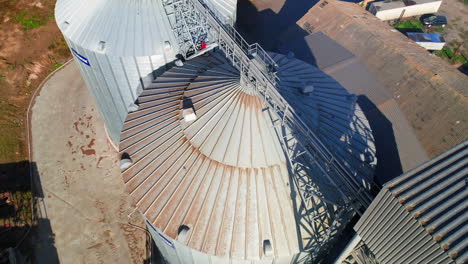 aerial view of metal grain elevator in agricultural zone. grain warehouse