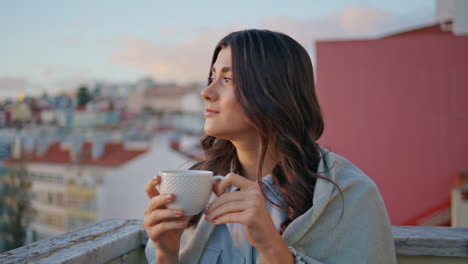 tender woman drinking espresso sunset town view balcony closeup. girl relaxing