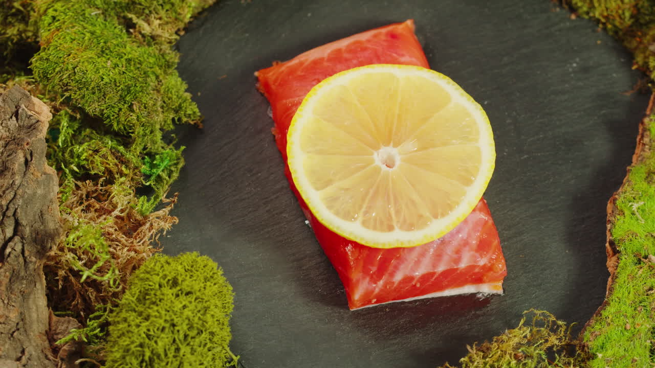 Preparing Salmon with Lemon on Moss