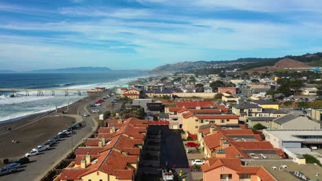 aerial view over the cityscape of pacifica city, sunny evening in california, usa