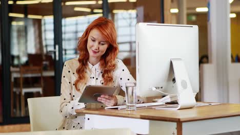 Businesswoman-using-digital-tablet