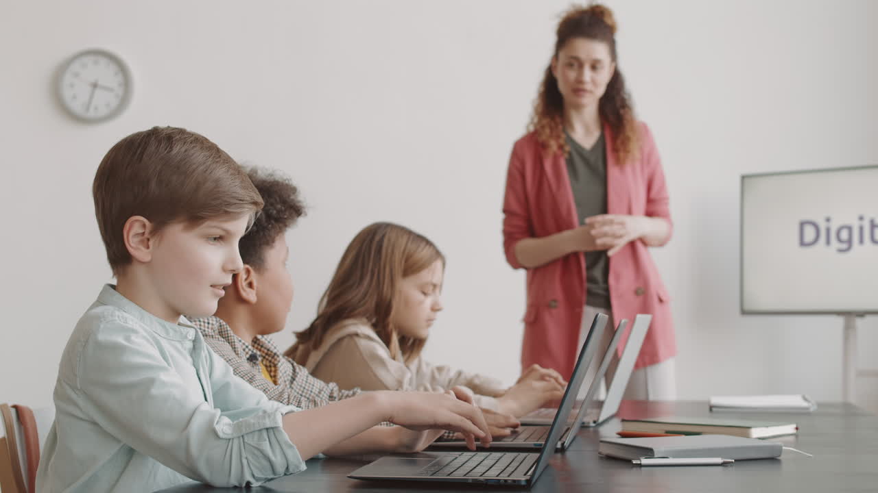 Children Using Laptop Computers in Classroom