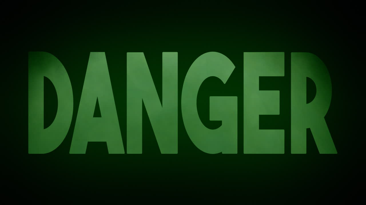 A rising cloud of green poisonous gas, revealing the text Danger, appearing from the darkness with an ominous glow