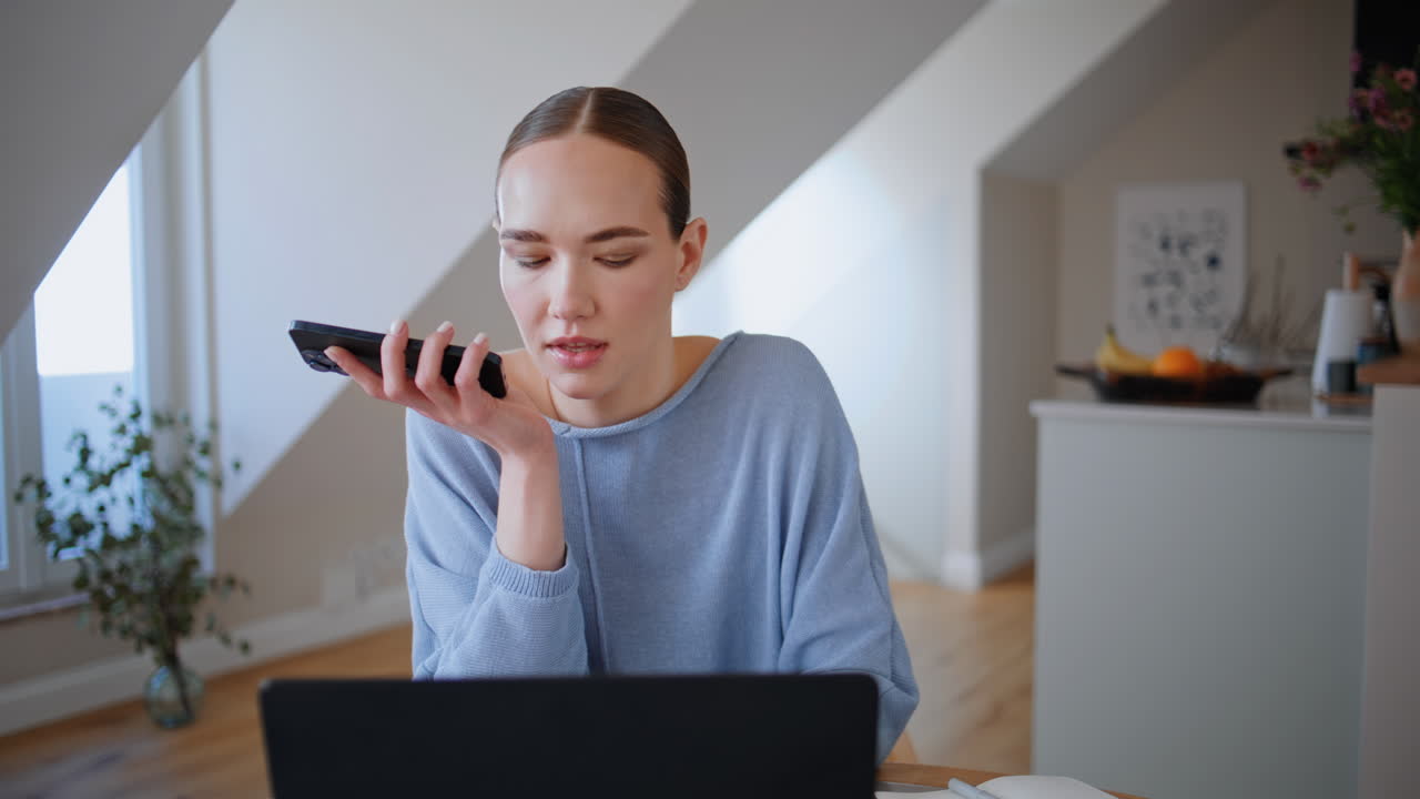 Domestic woman talking audio message at home office closeup. Manager send voice