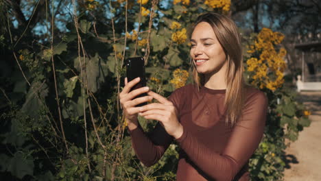 young woman using smartphone outdoors.