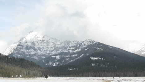 Slow-rightpan-of-storm-clouds-crowning-the-peaks-of-Yellowstone-mountains