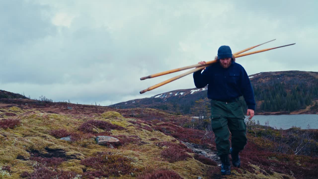 Man With Oars Walking Near The Lake In Åfjord, Norway - Wide Shot