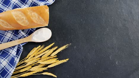 bread loaf with wheat grains and flour