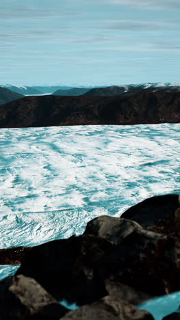 stunning view of a glacier in a mountainous landscape