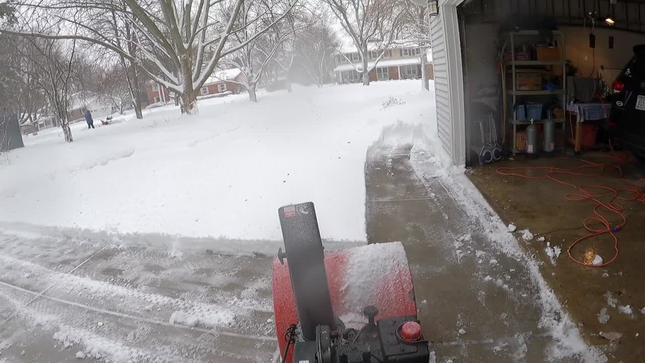 After a Wisconsin blizzard, removing snow is made easier with a snowblower