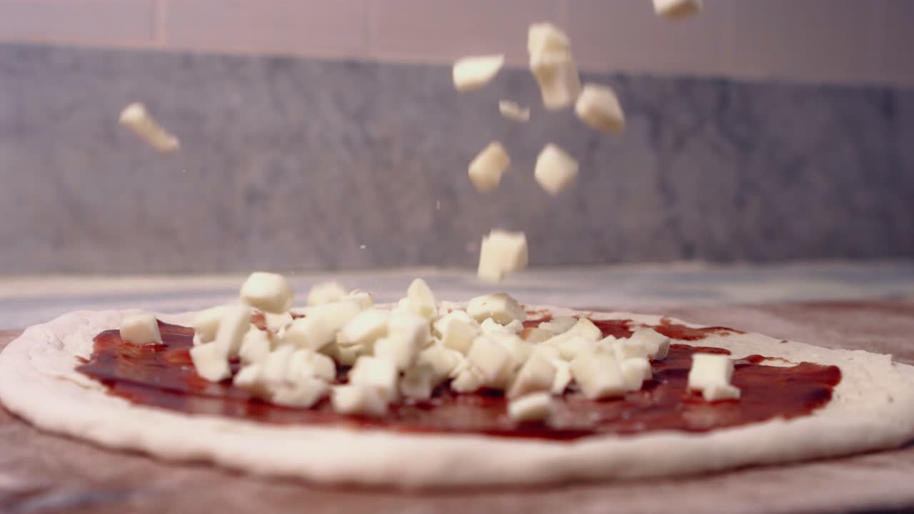 Chef throwing cheese in super slow motion 420 frames