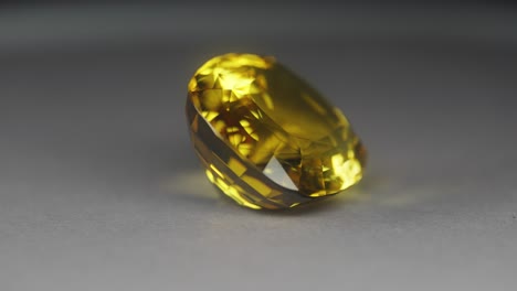 Polished-yellow-gemstone-rotates-and-sparkles