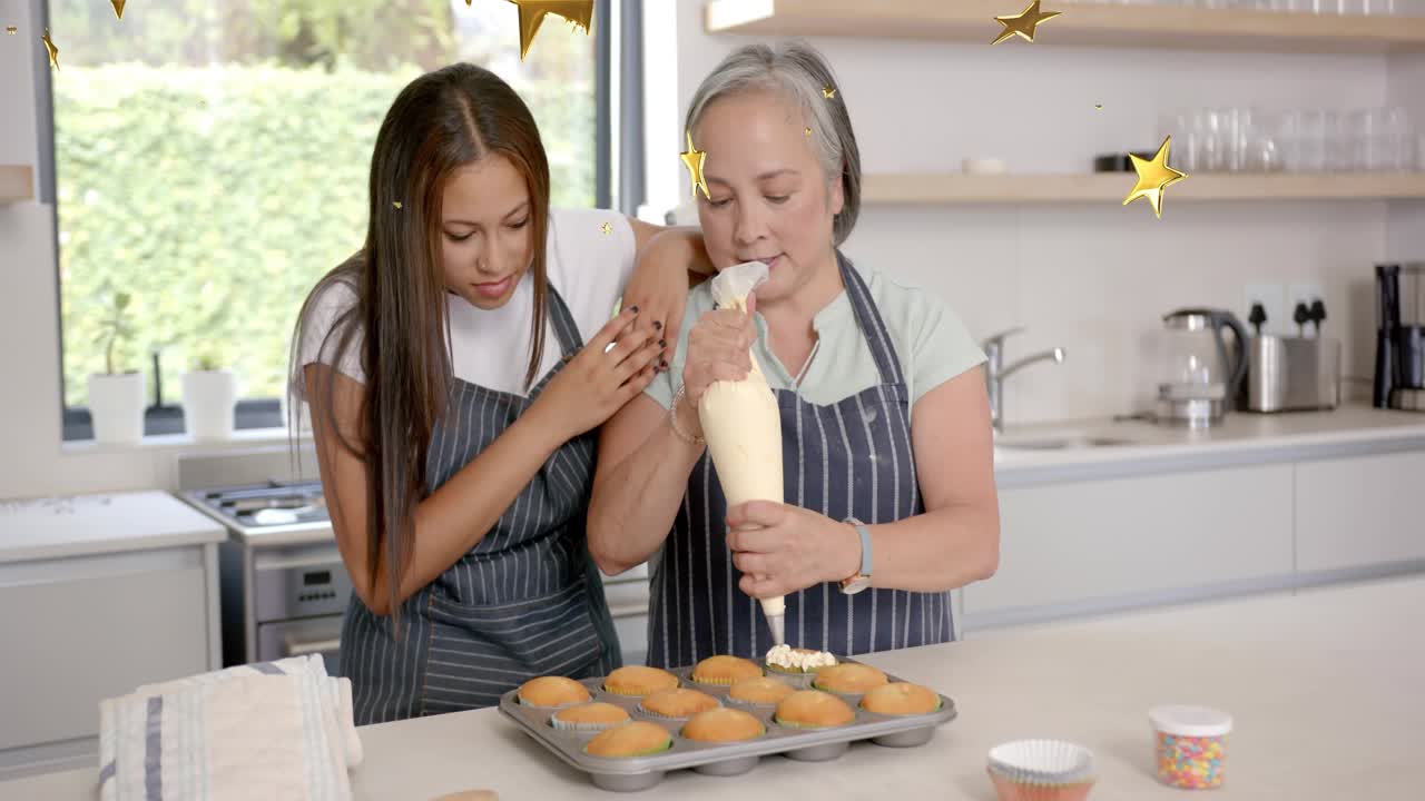Mom squeezing piping bag, icing cupcakes in baking kitchen, teen learning as gold stars overlaying