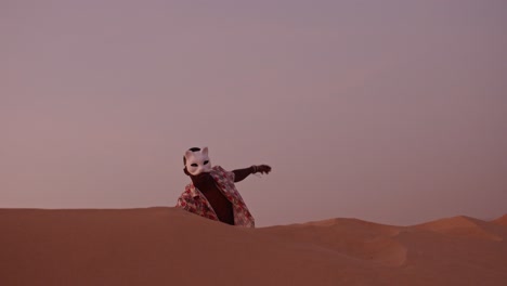 african american dancing in the desert during sunset uganda style