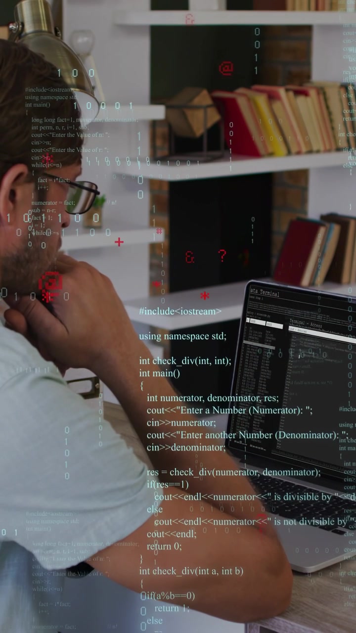 Vertical video: Coder sitting in study fixing gaze on laptop reading code with overlay over screen