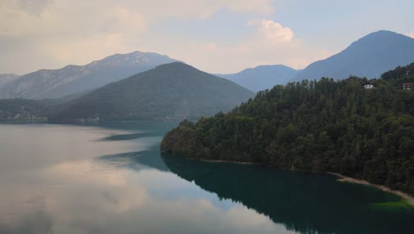 Stunning-sight-of-an-overflowing-turquoise-and-crystal-clear-lake-ledro-in-trentino,-north-italy