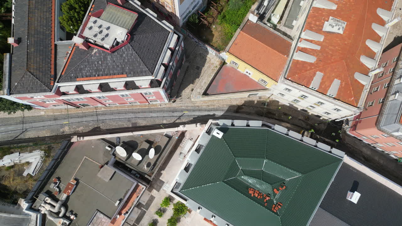 Birdseye aerial above the Elevador da Gloria crash site and streets of Lisbon