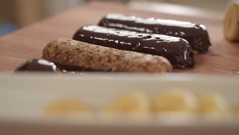 healthy oatmeal protein bars on wooden table surface, close up, slow motion