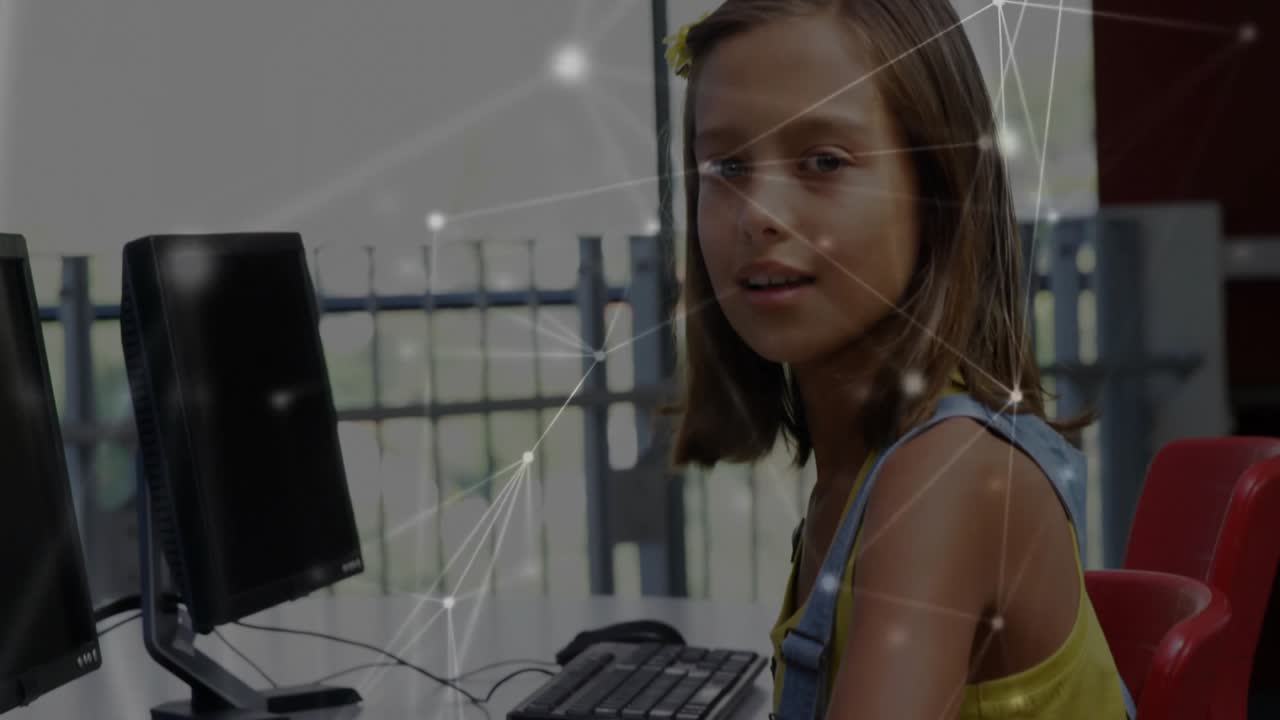 Student practicing coding initiating digital network overlay then pausing and smiling at camera