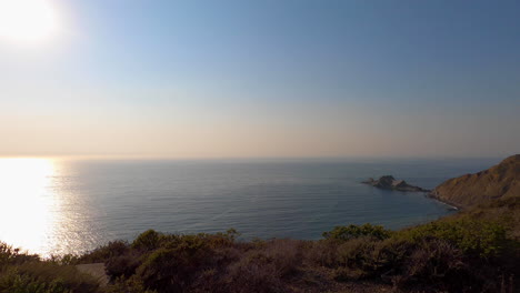 Medium-speed-pan-over-the-Northern-California-cliffsides-and-the-Pacific-Ocean-new-Devils-Slide-State-Park-and-San-Francisco-on-a-calm-summer-afternoon---4K