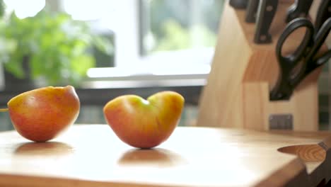 slow motion shot of two halves of an apple rocking back and forth