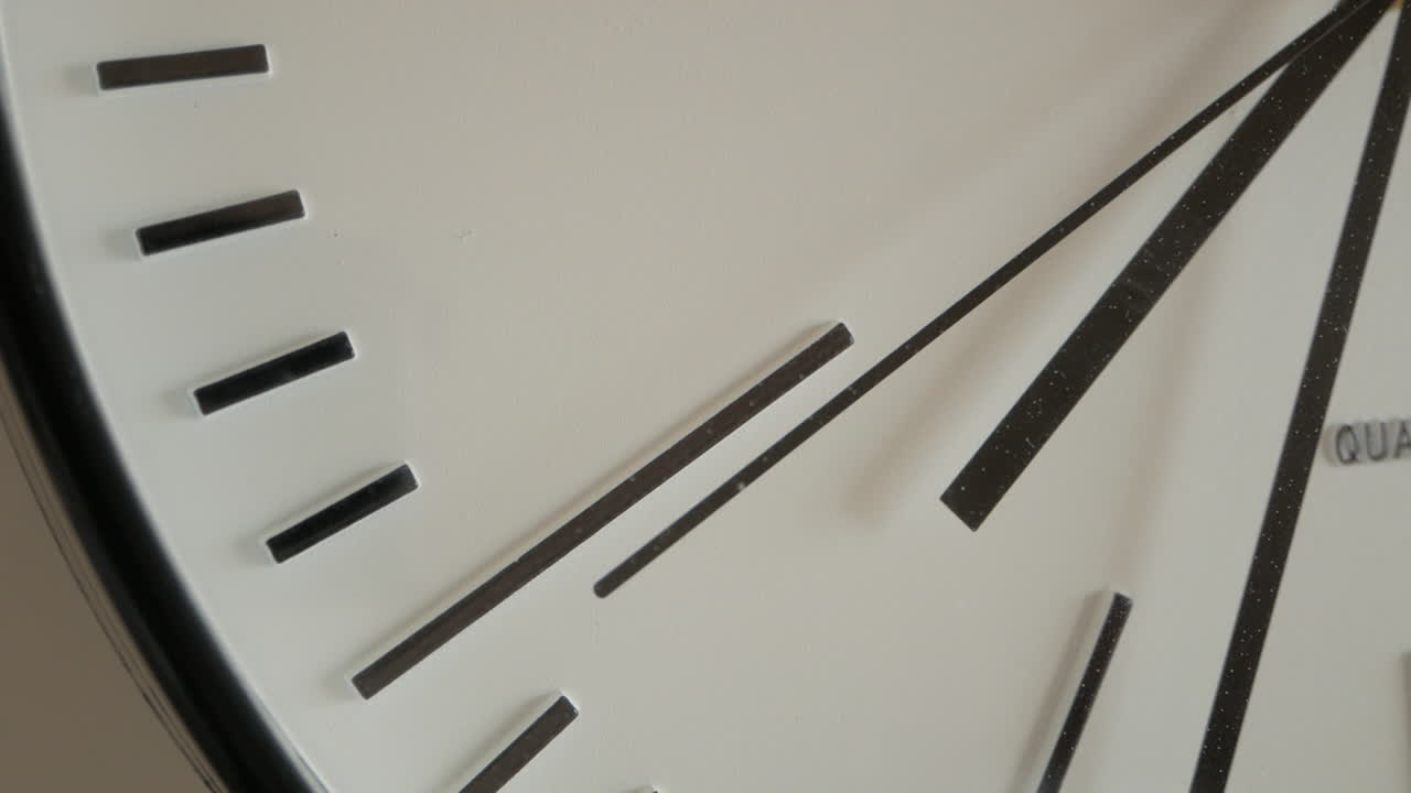 Stuck Second Hand Of A Broken White Wall Clock Ticks Repeatedly, Close Up Shot