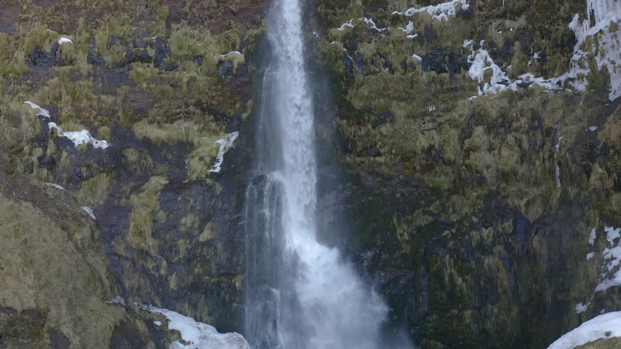 Flying straight up close to a waterfall in south Iceland.