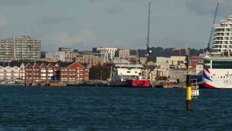 shot of the southampton skyline with the isle of wight ferry and a cruise ship on edge of frame