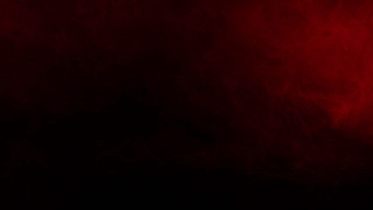 Ominous red fog or smoke drifts slowly across a dark background, perfect atmospheric texture for creating suspense in horror or thriller projects
