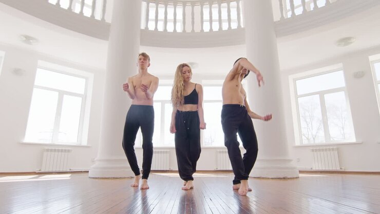 Three Professional Contemporary Dancers Training Dance Moves In The Studio 6